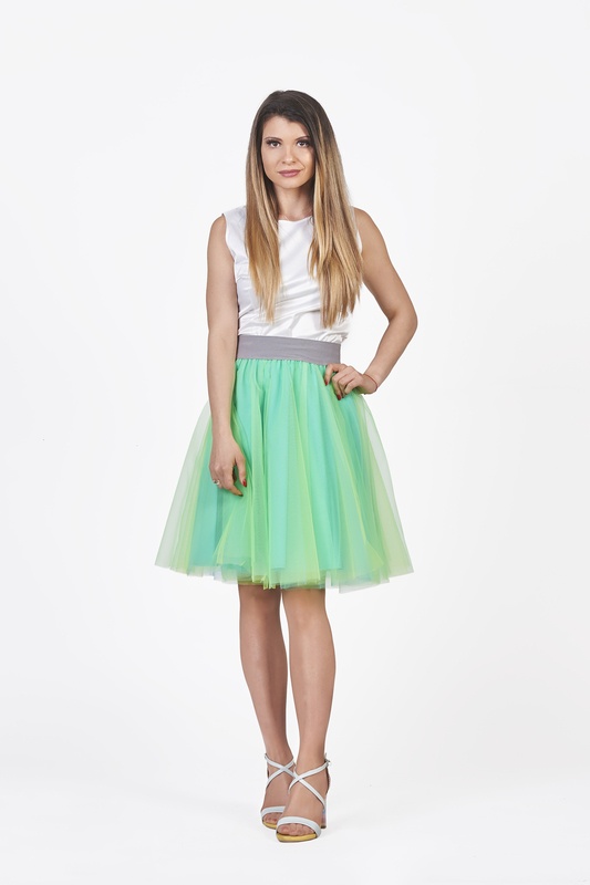 A mesmerizing image of the mini blue & green tulle skirt, showcasing its enchanting layers and unique color blend.