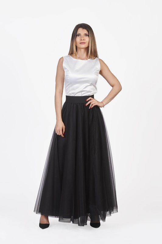 Long black tulle skirt showcasing timeless elegance and sophistication.
