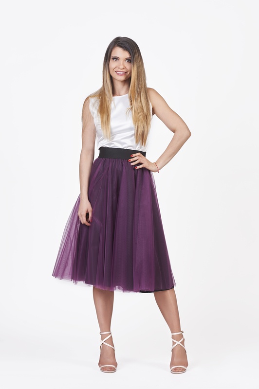 Feel the mystical movement of this midi tulle skirt, a captivating shade of deep purple.