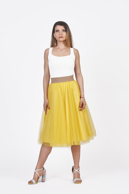 Be the brightest with our sun-kissed midi yellow tulle skirt, radiating splendor.