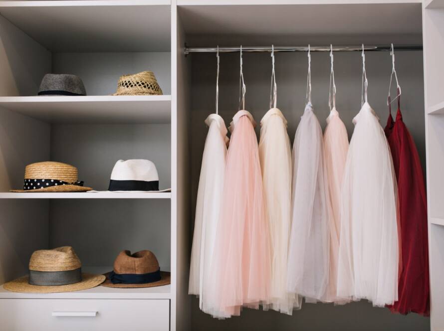 Image showcasing protective garment bags and tissue paper used for storing tulle fabric, emphasizing their role in preserving the fabric's ethereal allure and extending its lifespan.