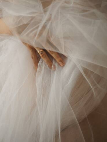 Captivating texture of ethereal tulle fabric, exuding grace and charm.